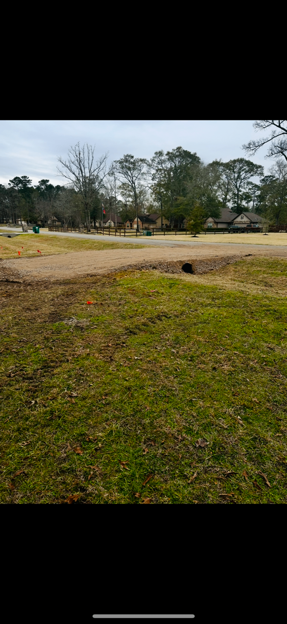 Finished driveway culvert with regraded front yard