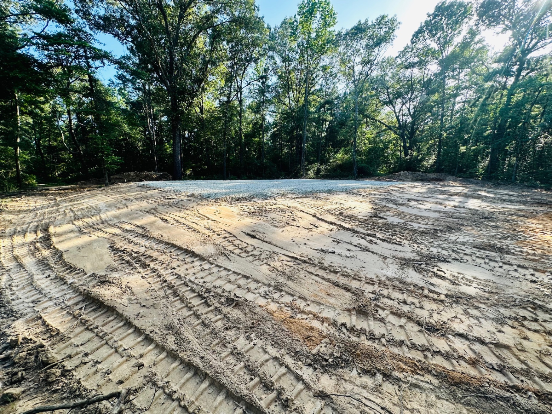 Backfilling around the new building pad to keep terrain looking natural